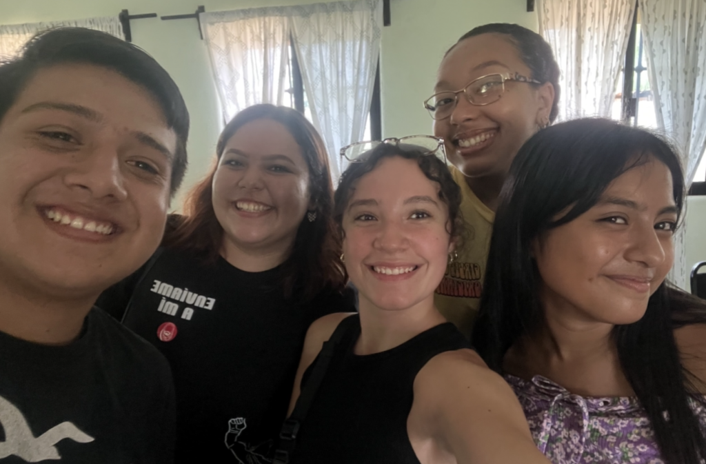 Picture of the student with 3 friends she made on the trip. 